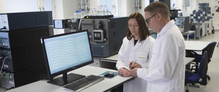 Picture of two scientists analyzing results